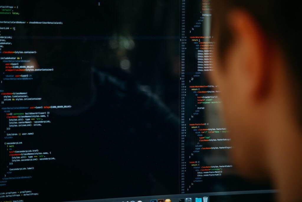 Person looking at code on a computer screen