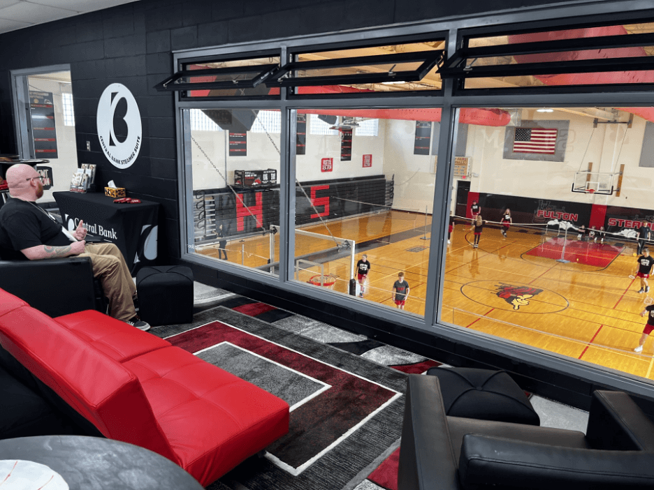 The transformed rental suite features floor-to-ceiling windows that offer a stunning bird’s-eye view of the gym.